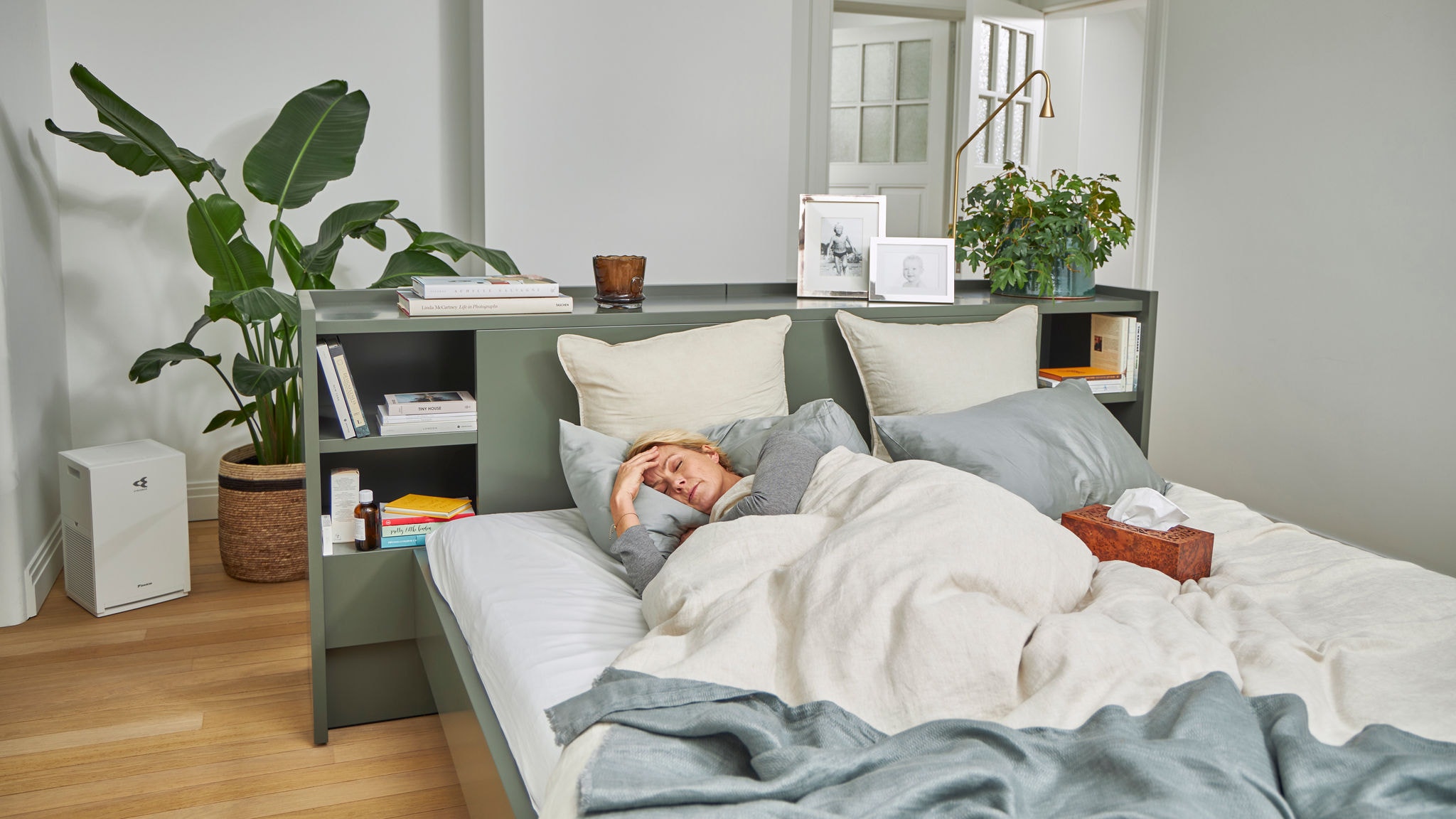 Woman sick in bed because of allergies